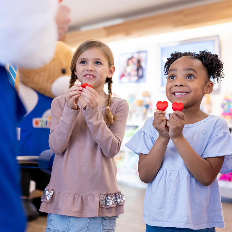People in Build A Bear store with bears
